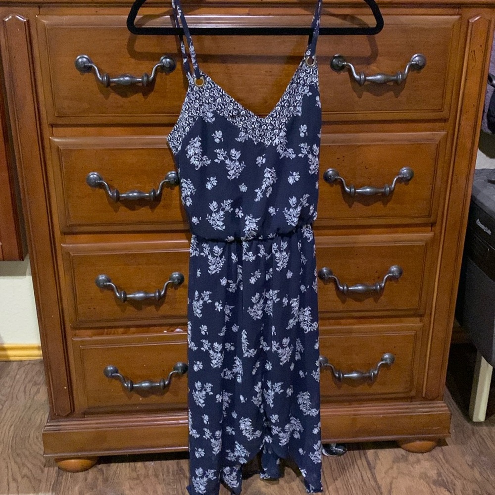 Blue and white flower patterned dress with a tie in the middle
